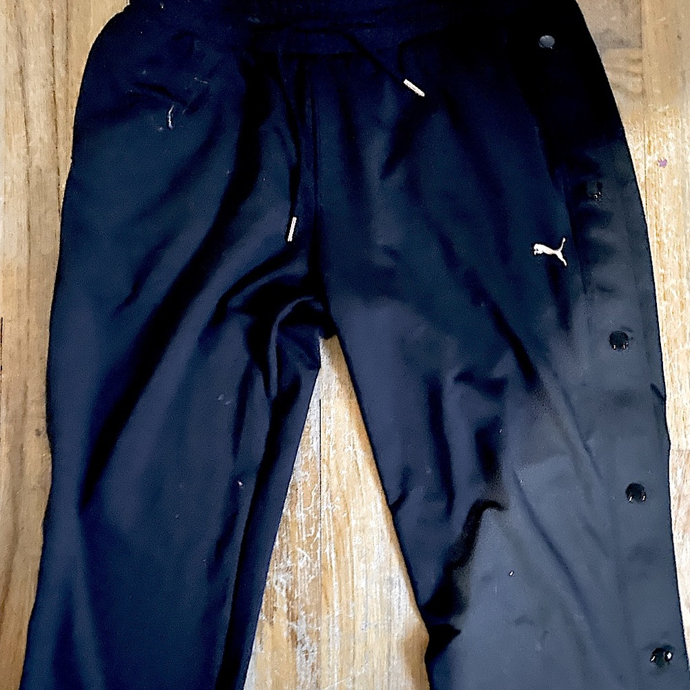 Black Puma snap up leg joggers with adjustable drawstring waist. S